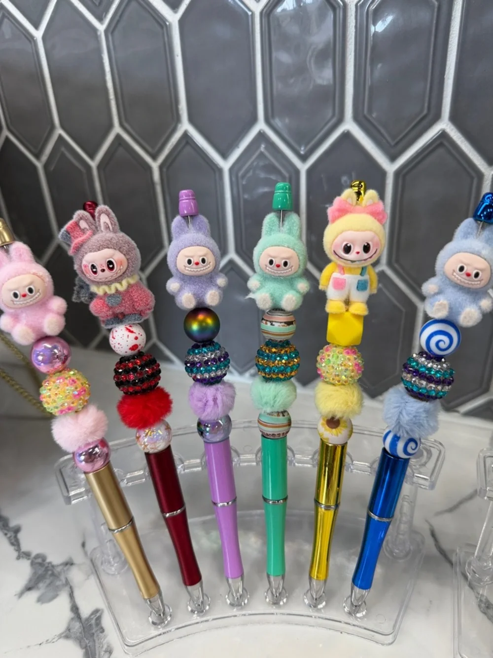 Whimsical Fuzzy Assorted Pastel Colored LaBubu beaded pens.